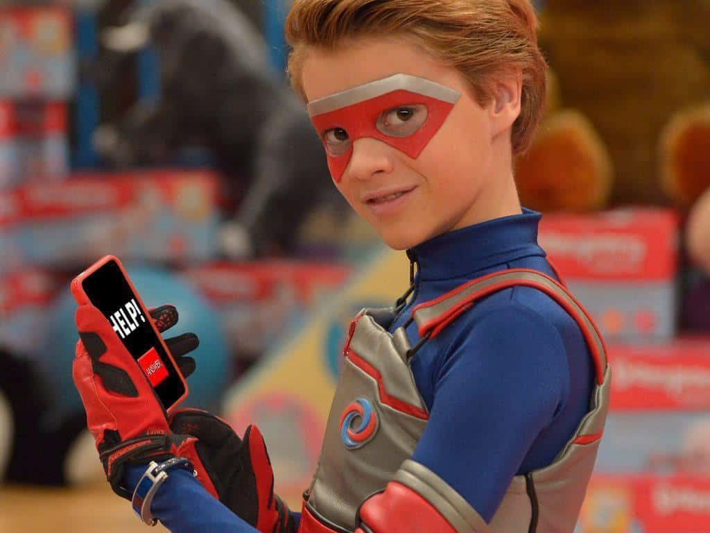 Henry Danger Kid Danger in blue red suit flashing HELP signal on smartphone wallpaper background