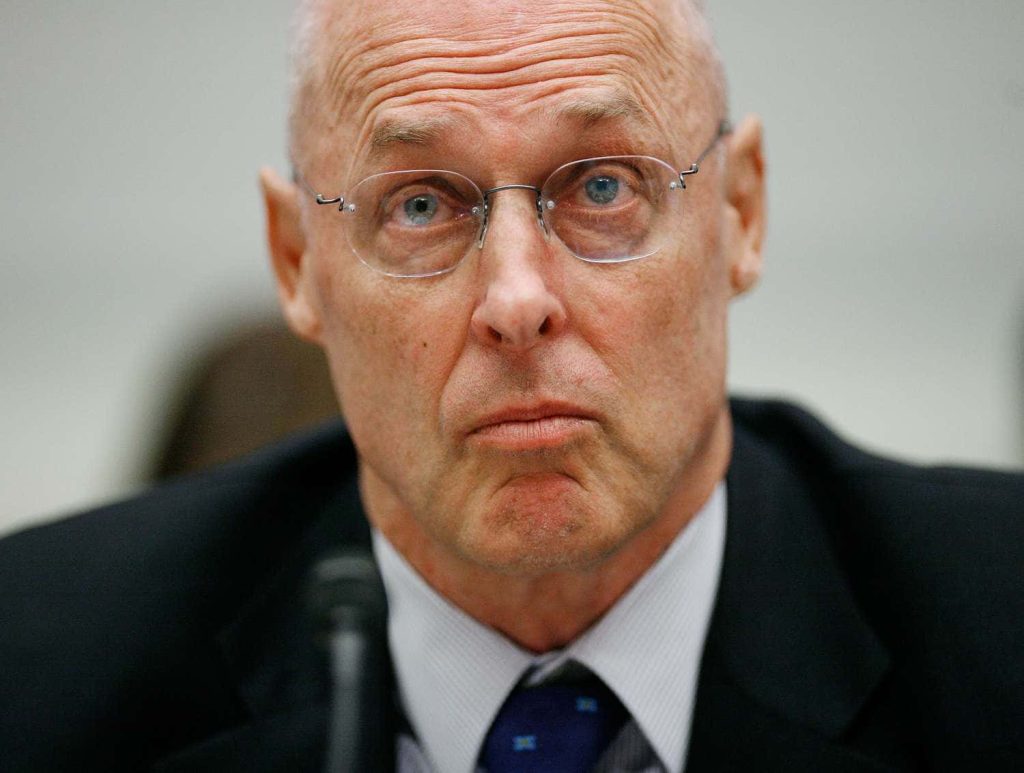 Henry M Paulson testifying at government hearing wearing rimless glasses and dark formal suit Wallpaper