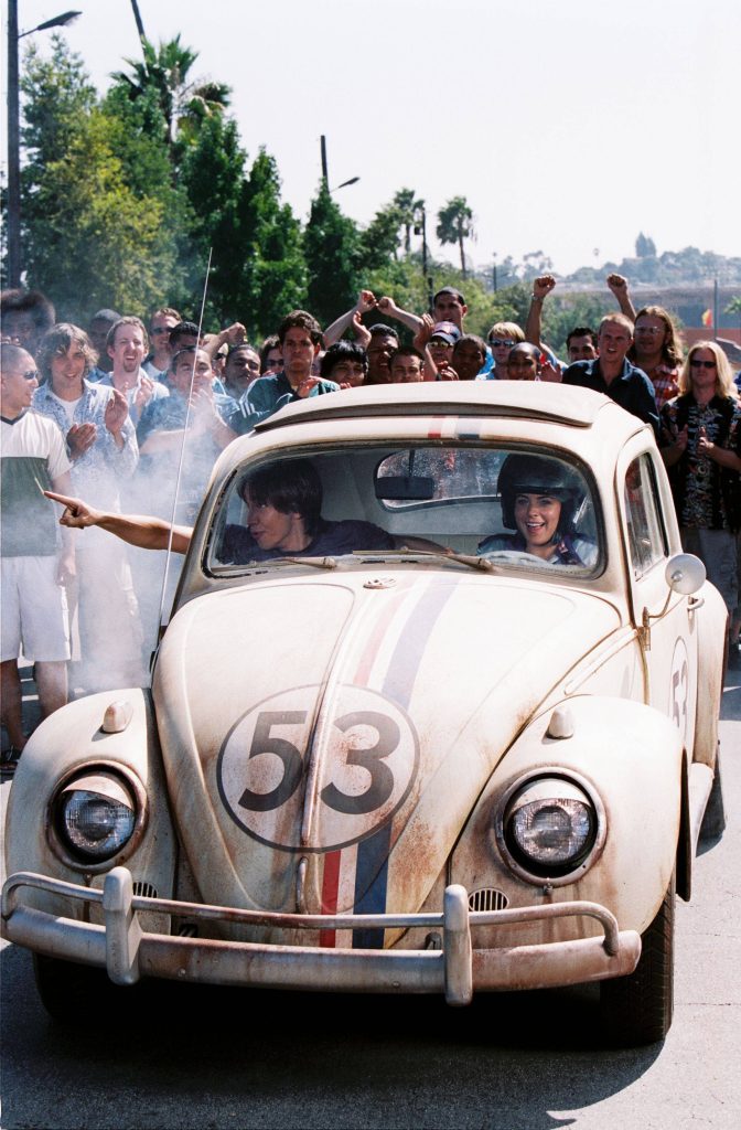 Herbie Fully Loaded wallpaper with Maggie Peyton and Kevin driving the classic Herbie VW Beetle