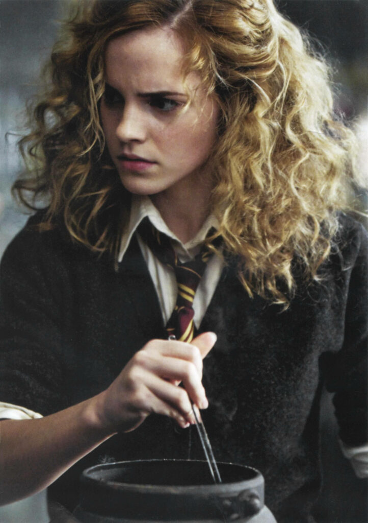Hermione Granger focused brewing potion magical wallpaper showcasing intelligence determination