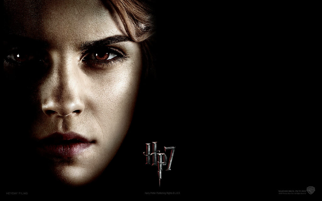 Close-up of Hermione Granger intense expression Harry Potter 7 wallpaper dark background