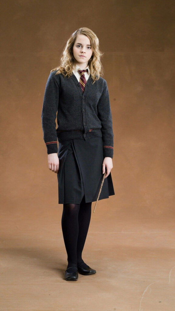 Witchy Elegance: Hermione Granger Graces Your iPhone Screen with her Wand in Hand Wallpaper