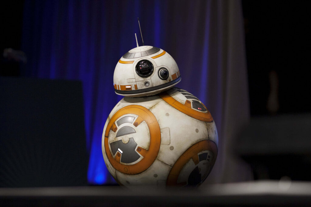 Heroic BB-8 droid Star Wars wallpaper with detailed orange white spherical mechanical design background