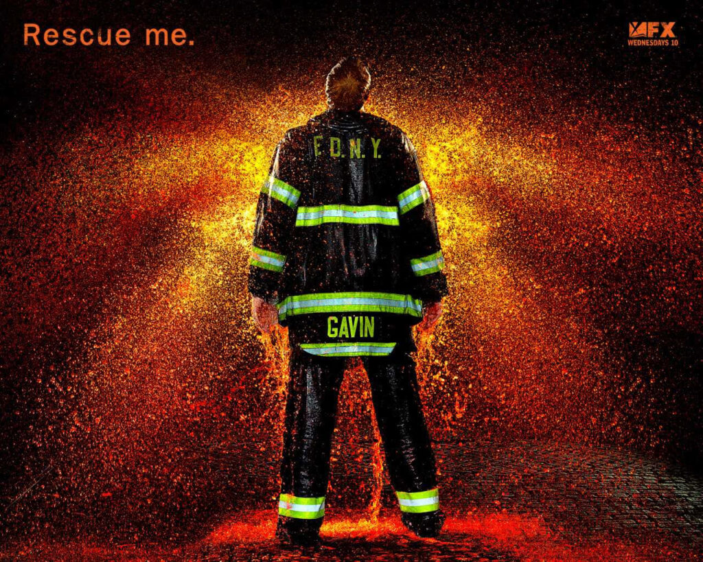 FDNY firefighter Gavin in full gear standing heroically with fiery background Rescue Me wallpaper