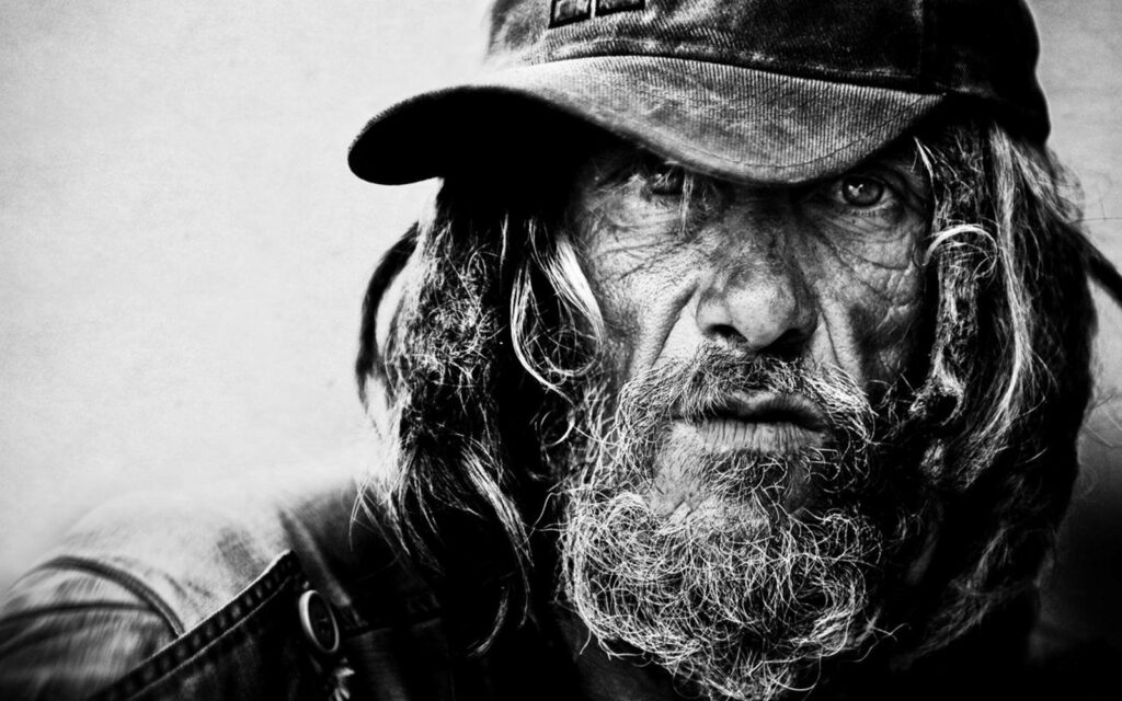 Scruffy Rugged Man in Cap - Striking Black and White Wallpaper