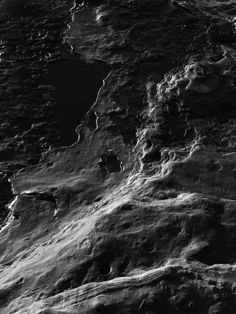 High-Contrast Monochrome Lunar Surface Wallpaper - Dramatic Space Background