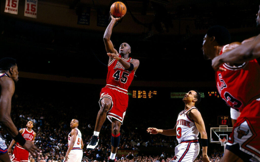 The Air Apparition: Legendary Michael Jordan leaps to greatness in a mesmerizing hoops display Wallpaper