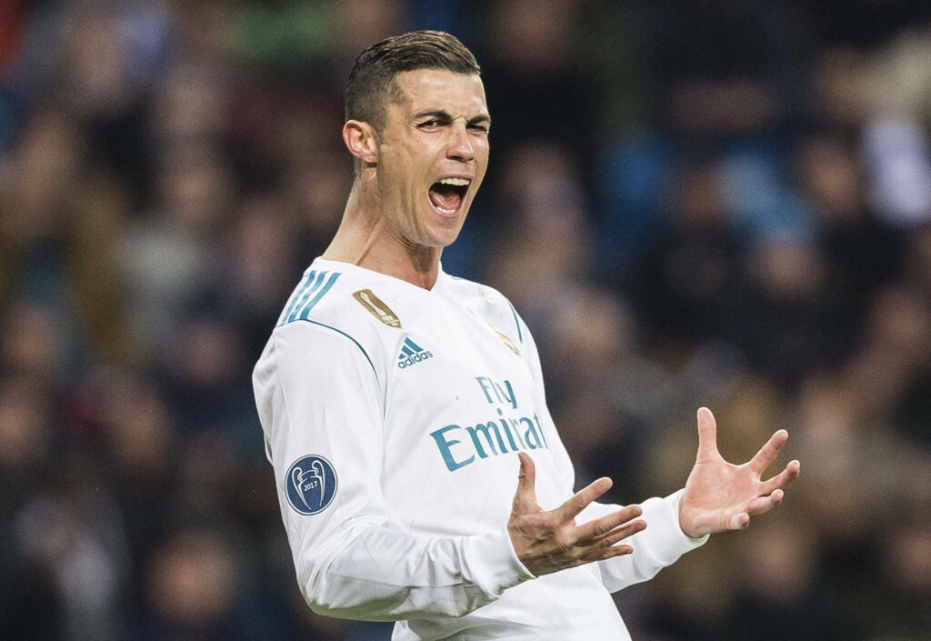 High-Definition CR7 Wallpaper: Cristiano Ronaldo Celebrating Intense Action