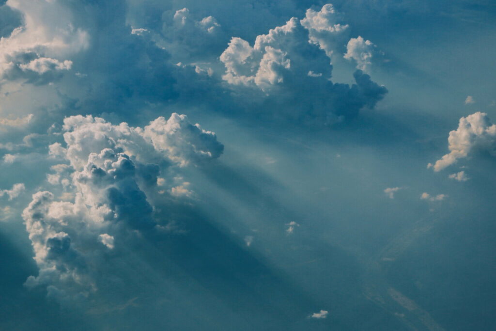 Aerial View of Fluffy Cumulus Clouds in Serene High-Def Sky Background Wallpaper