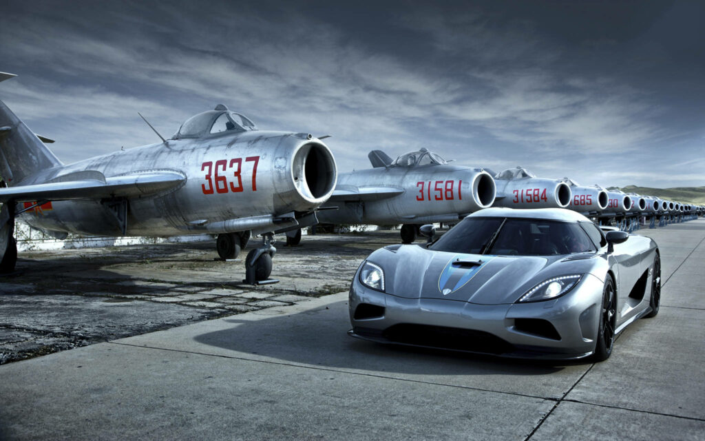 Flight of the Gray Koenigsegg: A Cool Car on the Aviation Field Wallpaper