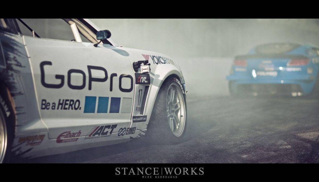 GoPro drift car in tire smoke on track high-octane Formula Drift racing wallpaper background