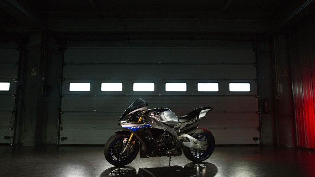 Stylish Motorcycle Wallpaper: Sleek Design in Dimly Lit Garage