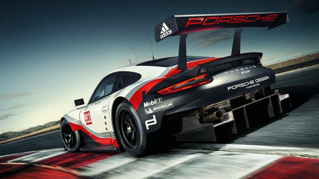 High performance Porsche racing car speeding on racetrack curve dynamic digital wallpaper background
