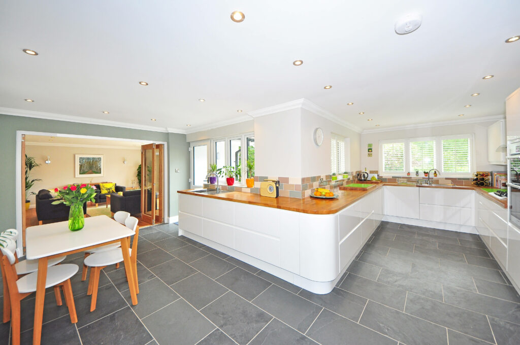 Functional Elegance: Captivating Wallpaper and Outstanding Design in a Wide Kitchen Area