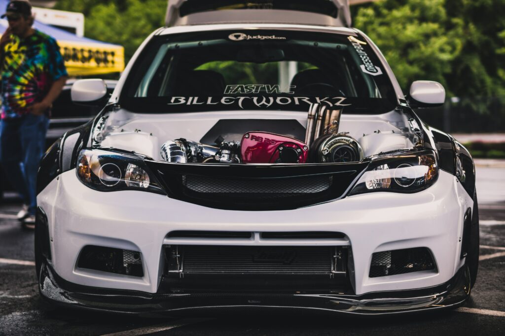 Subaru Impreza WRX STI: Aggressive Design in Lush Greenery Wallpaper