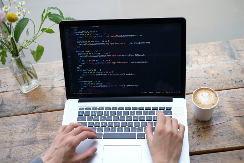 High-Res Laptop Coding Wallpaper with Coffee & Casual Workspace Vibe