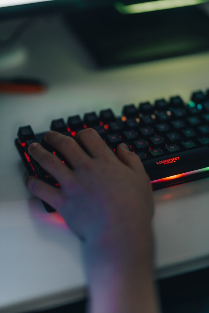 High-Res Gamer's Hand on RGB Keyboard - Dynamic Wallpaper Background