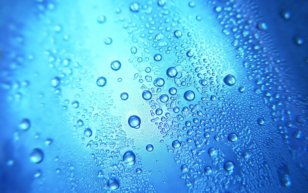 Refreshing Abstract Water Droplet Wallpaper on Smooth Blue Surface