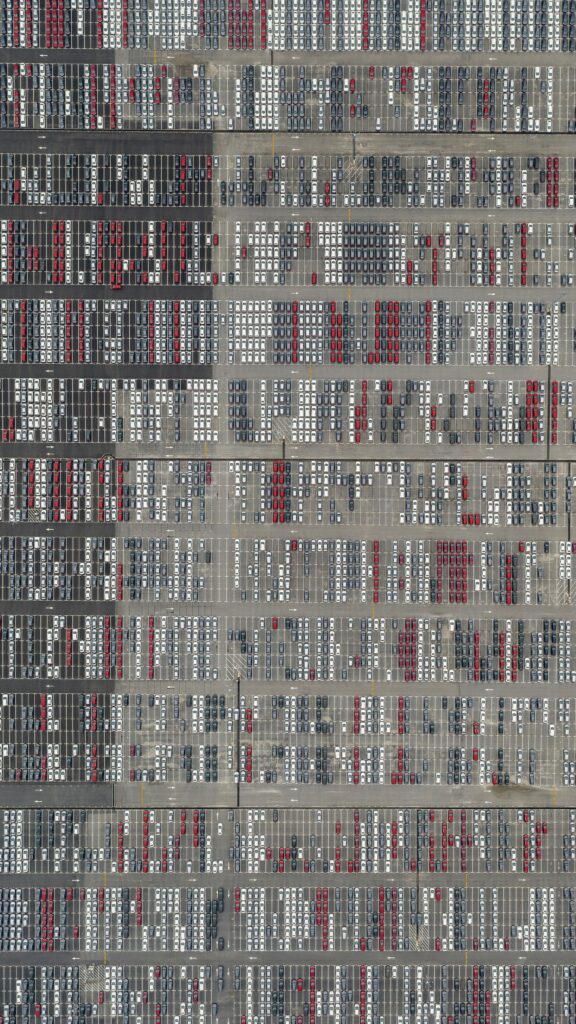 Expansive Aerial View of Colorful Cars in Neat Parking Lot Wallpaper