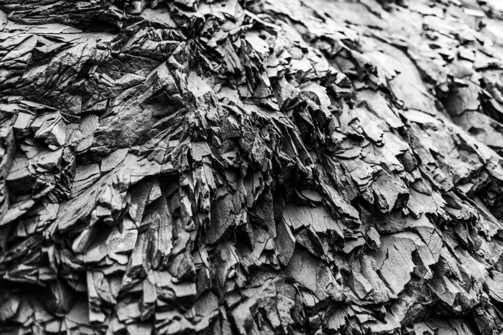 High-Resolution Black Rock Texture Wallpaper Background with Intricate Layers