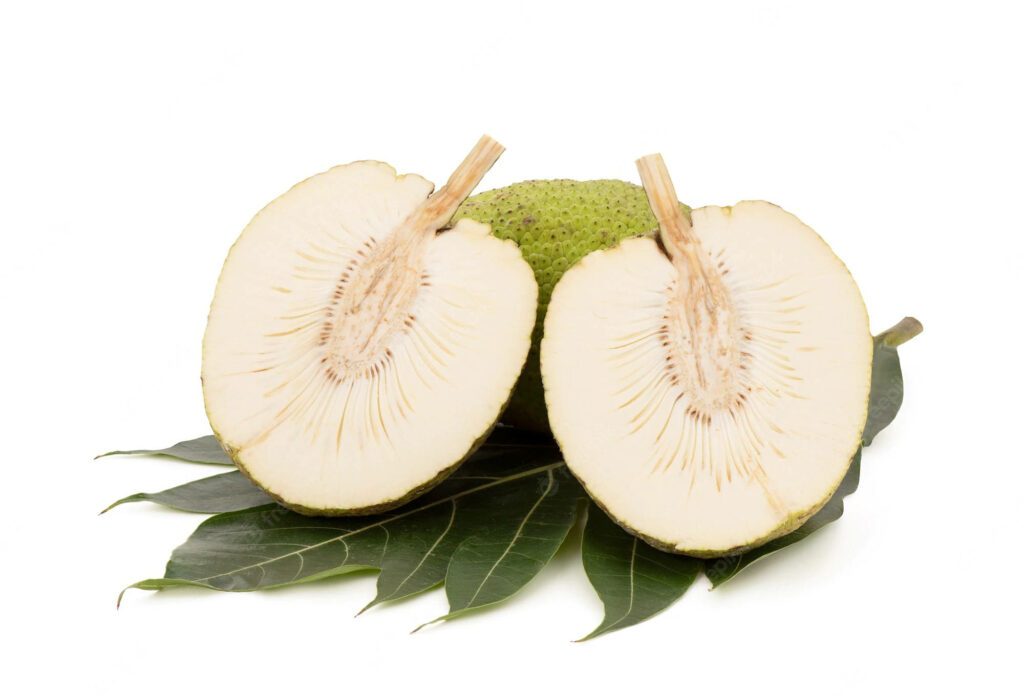 Two breadfruit slices on green leaves showing creamy texture and tropical patterns on white background Wallpaper