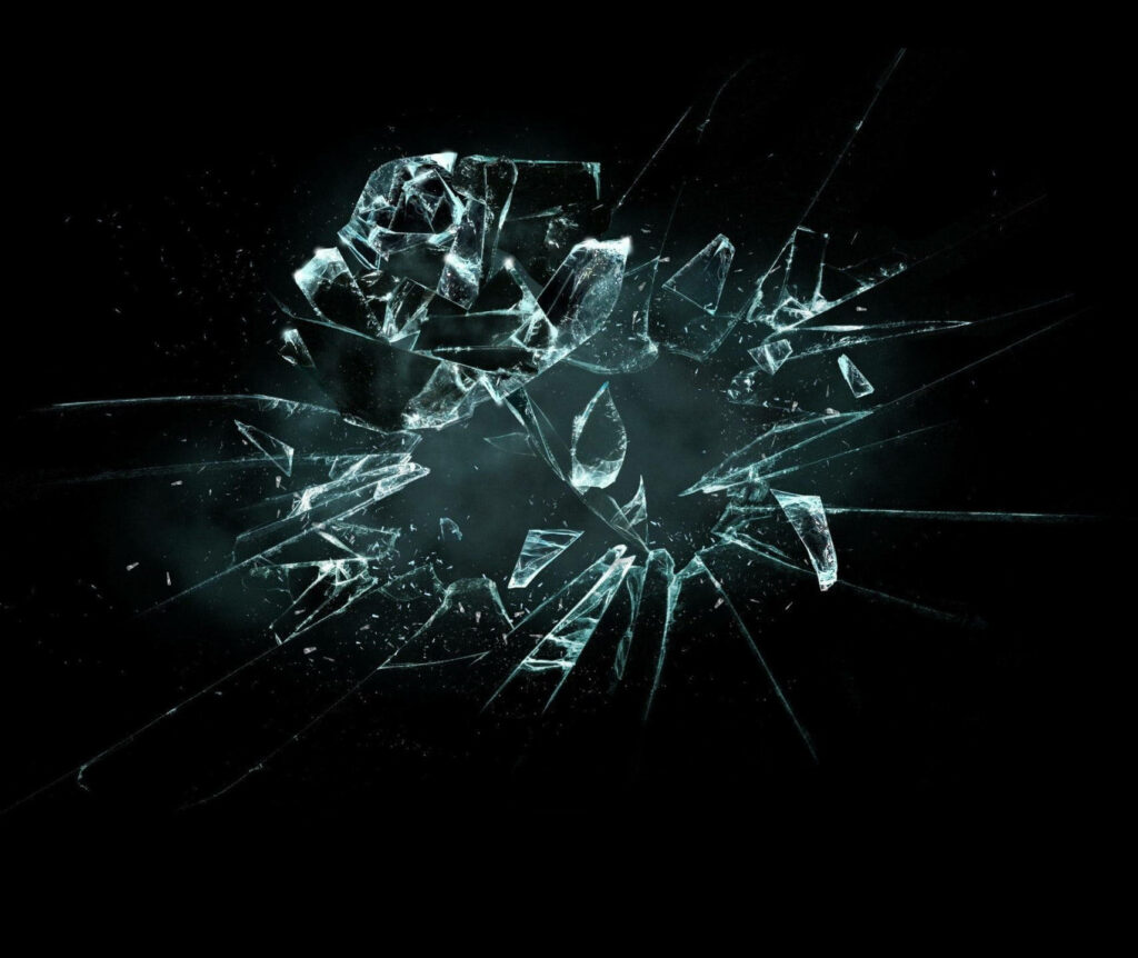 High resolution broken glass wallpaper with sharp shattered fragments on black background