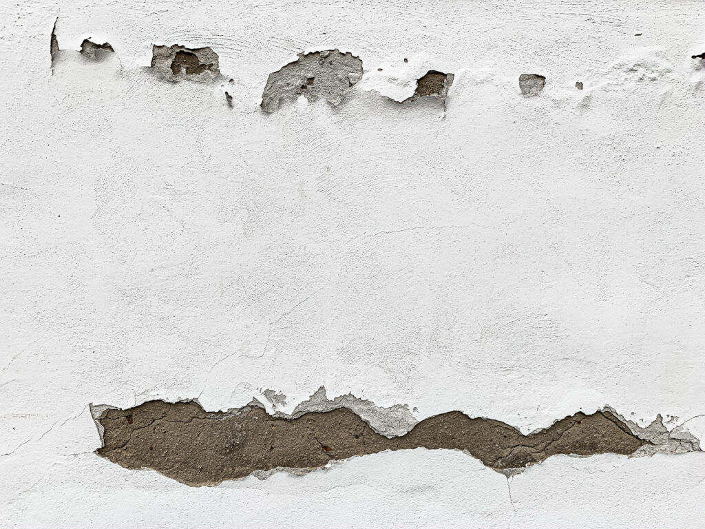 High-Res Texture Wallpaper: Rugged Broken White Wall with Cracks