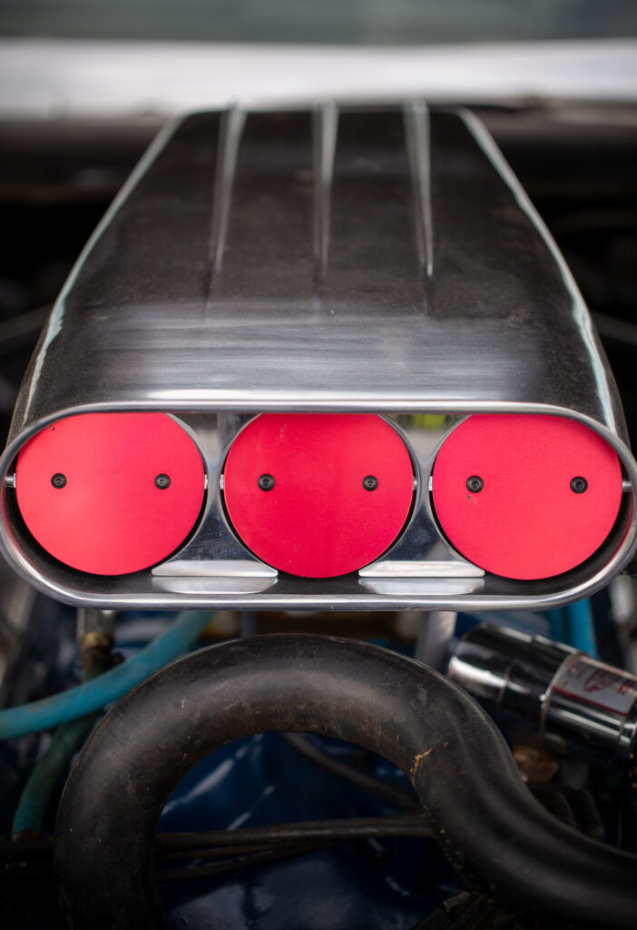 Close-Up Car Engine Wallpaper: Sleek Air Intake & Red Covers