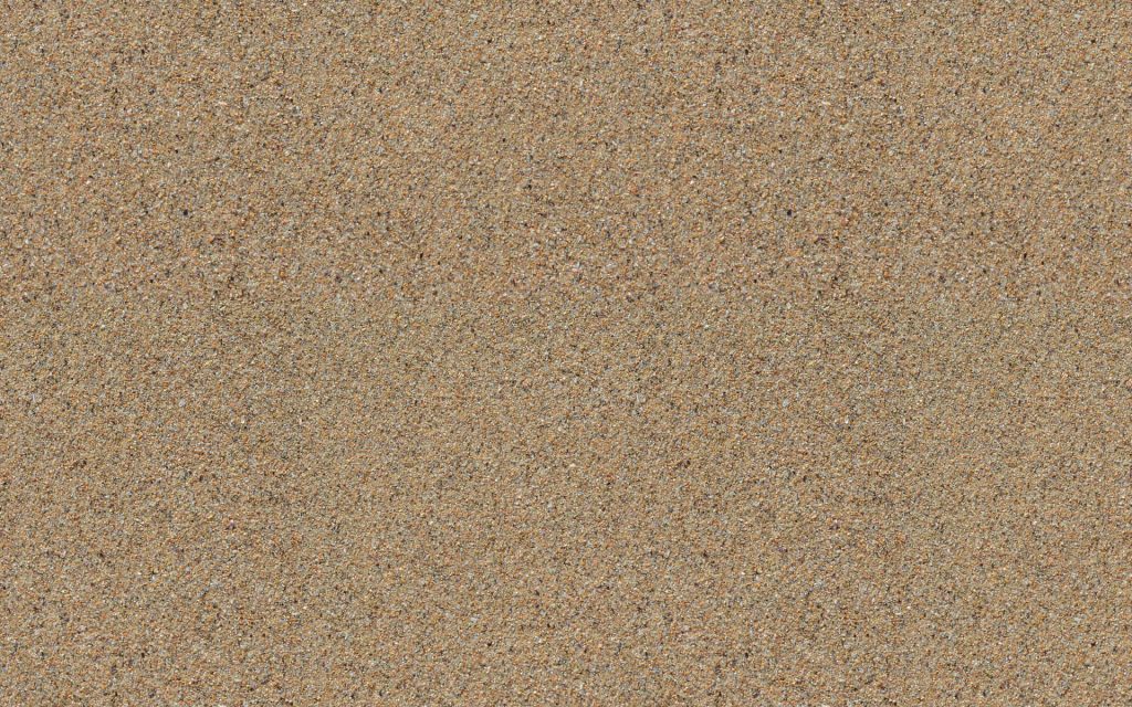 Close up of high resolution natural beach sand texture in warm beige and tan tones wallpaper