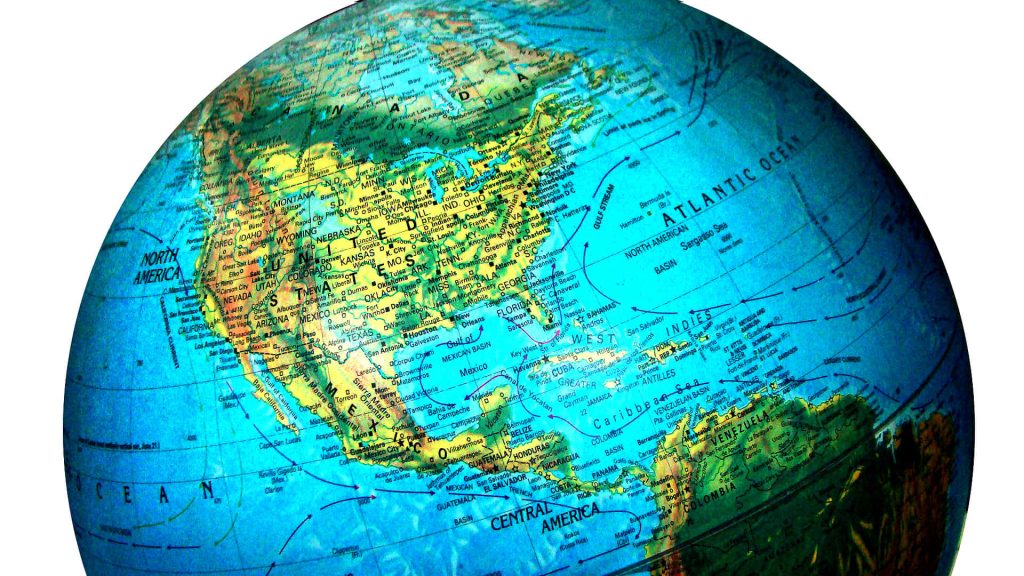 High-resolution globe map wallpaper showing North America Caribbean and Atlantic Ocean vibrant blue waters