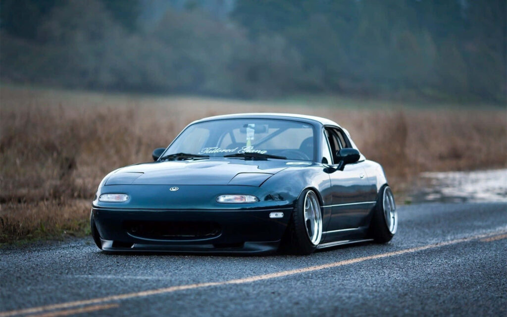 Sleek Mazda MX-5 Miata Wallpaper: Sporty Convertible in Nature