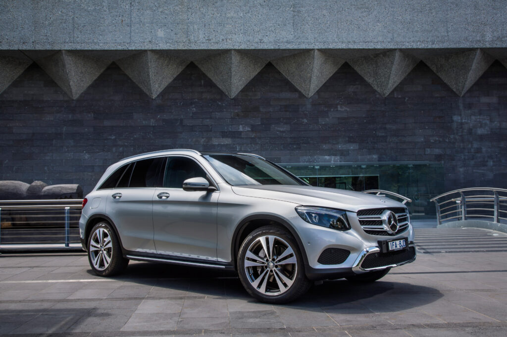 Sleek Mercedes-Benz GLC-Class X253 Wallpaper with Modern Background