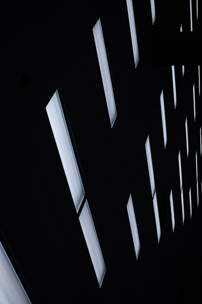 Futuristic Black Minimalist Wallpaper with Glowing Light Panels