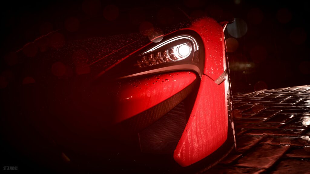 Close-Up of Red Sports Car Headlight with Raindrop Drama Wallpaper
