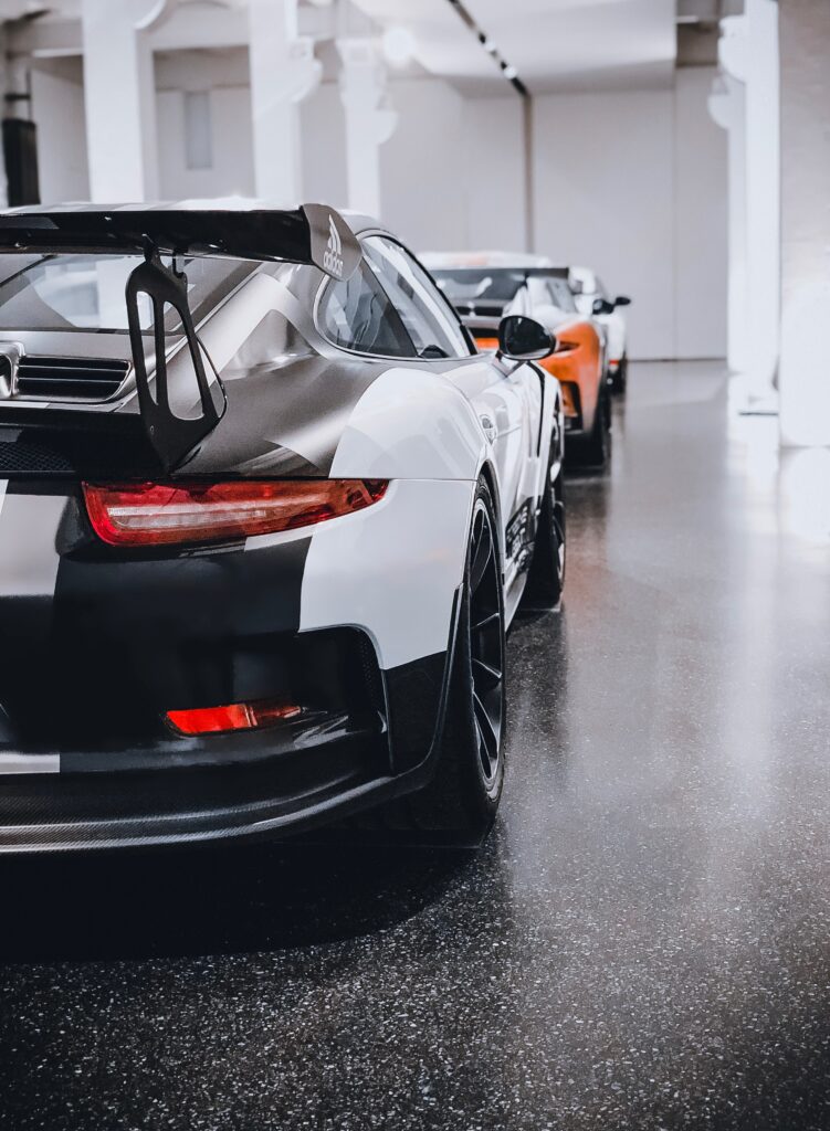 Dynamic Sports Car Rear View Wallpaper with Stylish Spoiler
