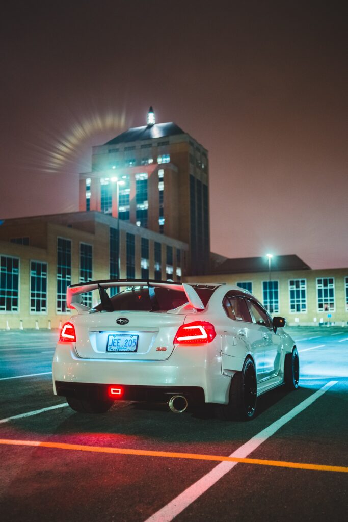 High-Resolution Subaru STI Rear View Wallpaper in Urban Setting