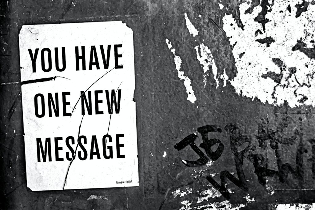Urban Black and White Wallpaper with Distressed Message Sign