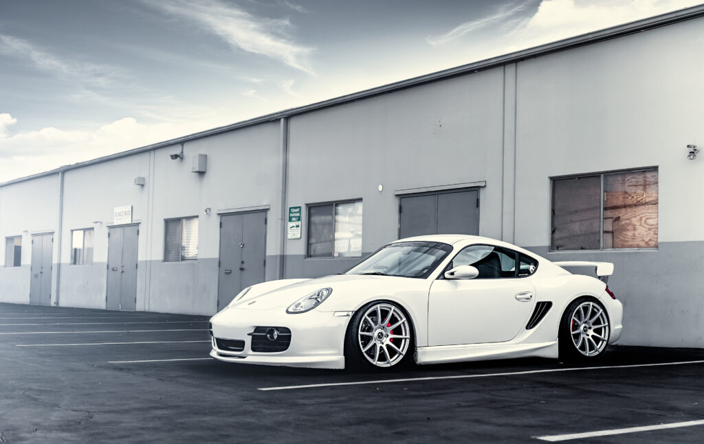 Stylish White Porsche Wallpaper in Industrial Setting - HD Image