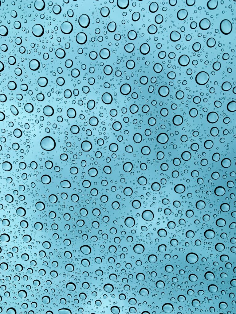 High-Res Water Droplet Wallpaper: Calm Blue Background Design