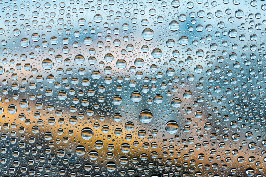 Serene Water Droplets Wallpaper: 6000x4000 Blue-Orange Background