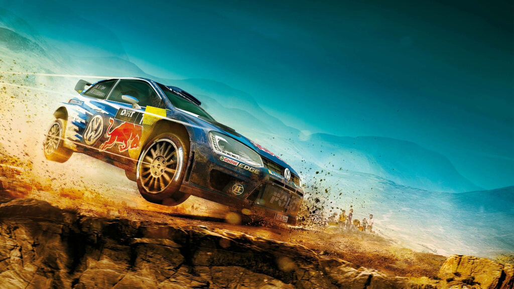 Blue and yellow rally car racing off-road kicking up dirt against sunlit mountain backdrop wallpaper