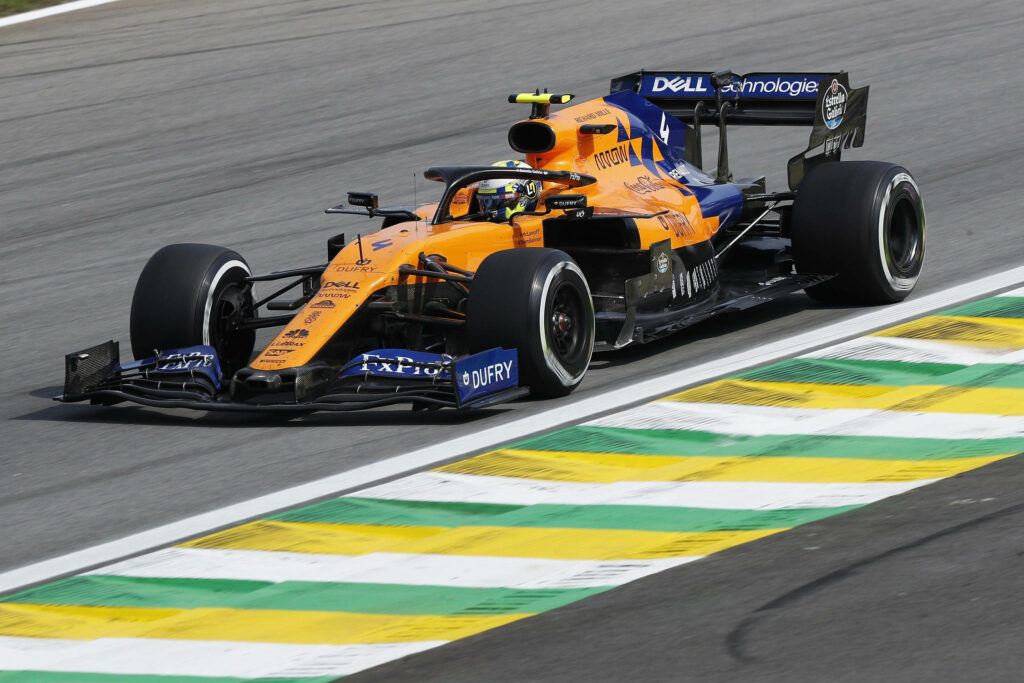 Formula 1 race car speeding on track high speed motorsport action dynamic racing wallpaper