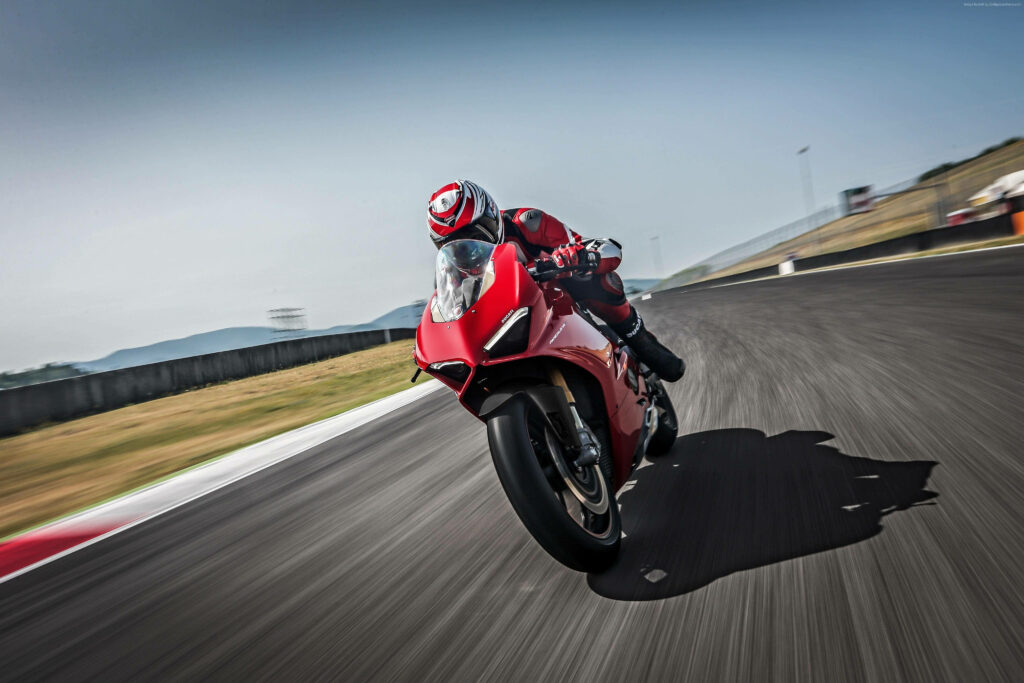 High-Speed Motorcycle Racer Curve Action Wallpaper - Red Bike Precision