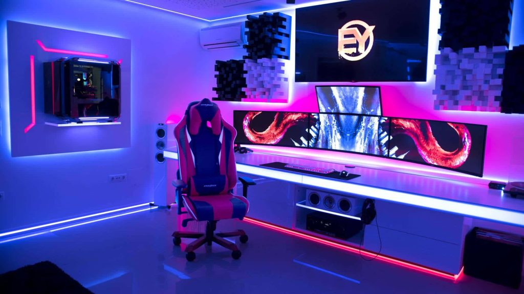 High-tech gaming room with white desk triple monitors neon RGB lighting DXRacer chair Echo Fox screen Wallpaper