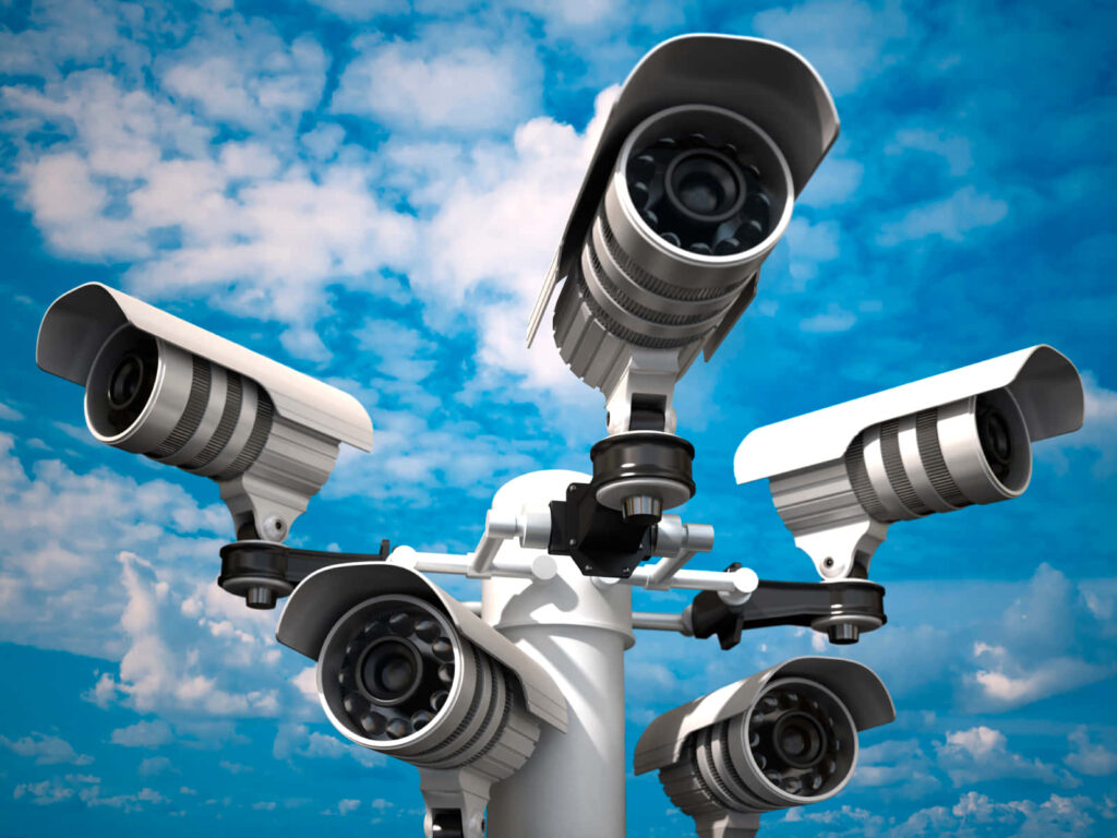 High-Tech Security Camera Wallpaper Against Blue Sky - Modern Surveillance