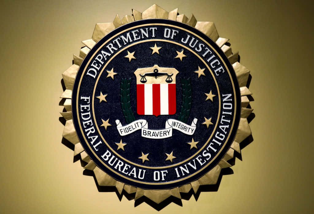 High-resolution FBI wallpaper featuring official seal with Fidelity Bravery Integrity motto and gold border
