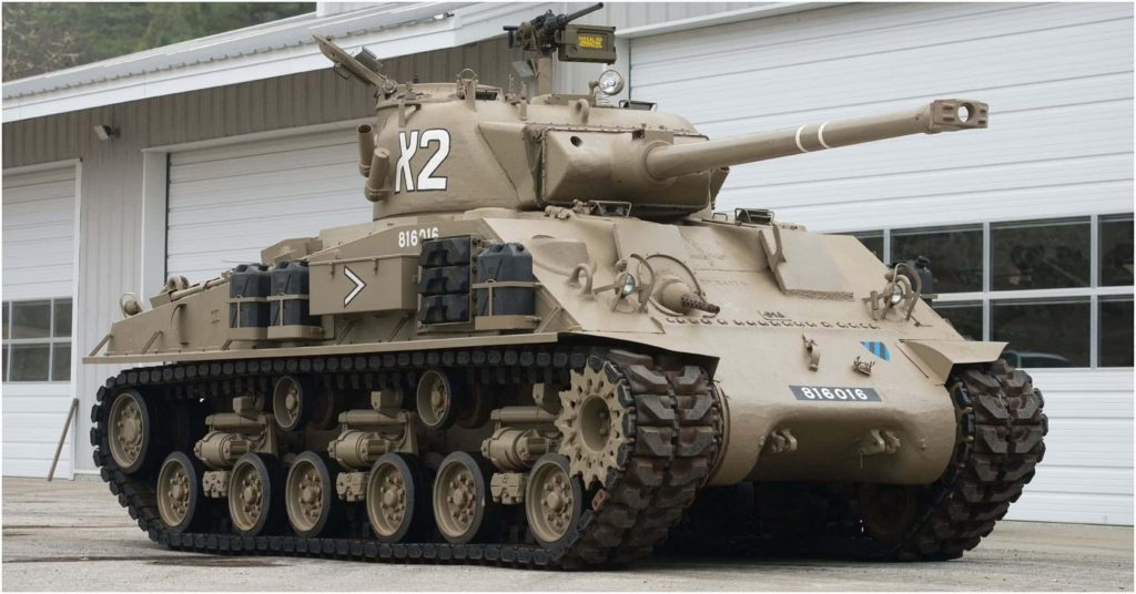 High-resolution M4 Sherman tank with desert tan finish and X2 turret markings wallpaper