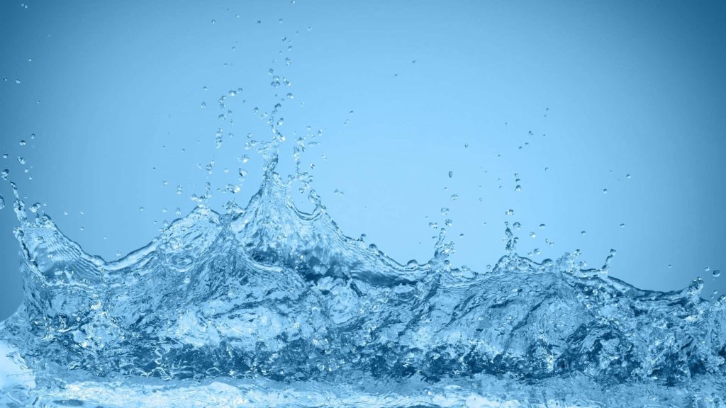 High-speed photo of detailed water splash droplets on smooth cool blue gradient background Wallpaper