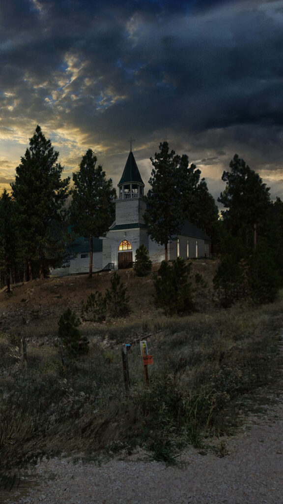 Spiritual Sanctuary Embraced by Majestic Forests in Far Cry 5 Wallpaper