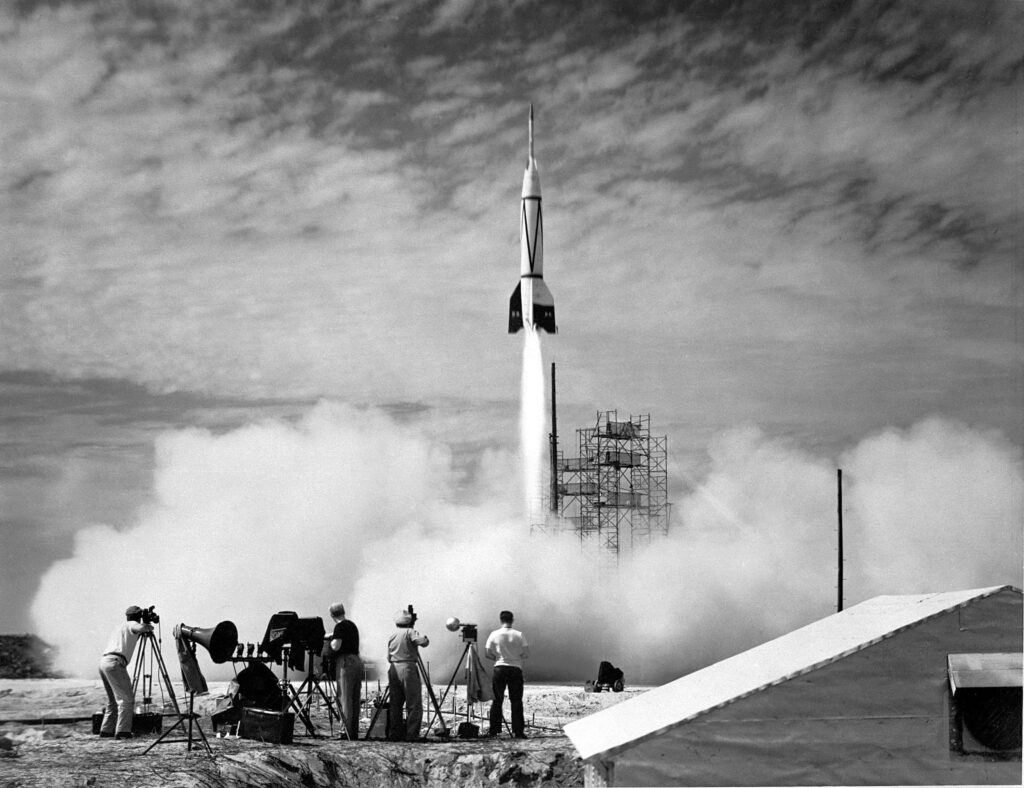 Historic NASA Rocket Launch: Black & White Spectators Wallpaper